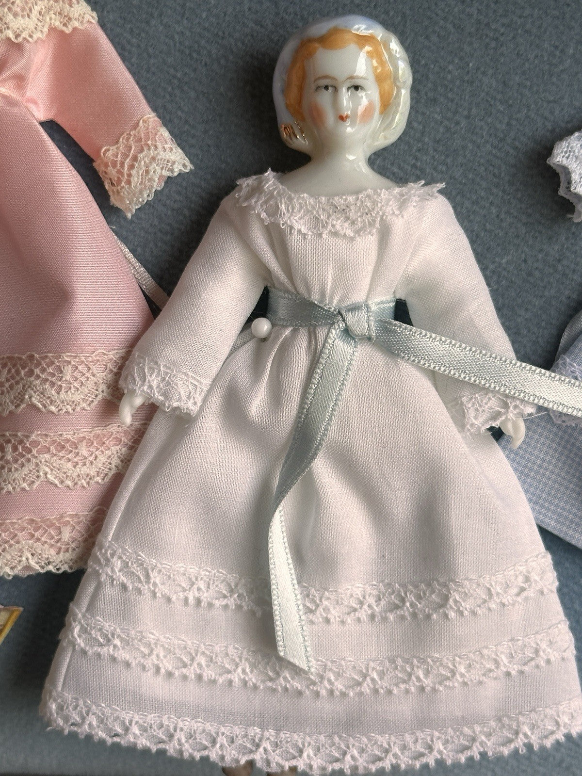 Collectible UFDC Porcelain Repro of China Doll by Rosemarie Snyder with Wardrobe