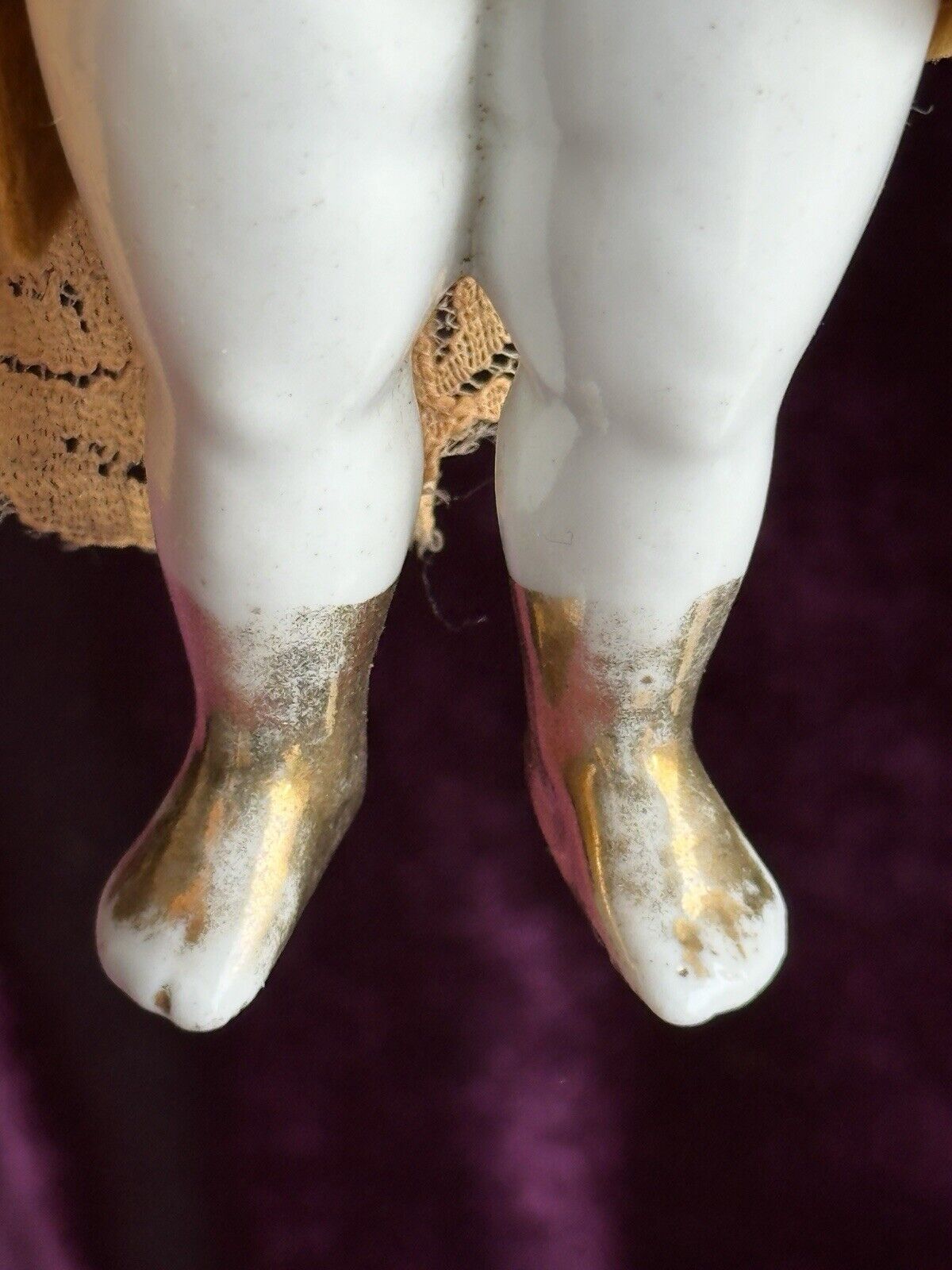 Rare Antique German 6.75” Frozen Charlotte Painted Gold Molded Bow Doll