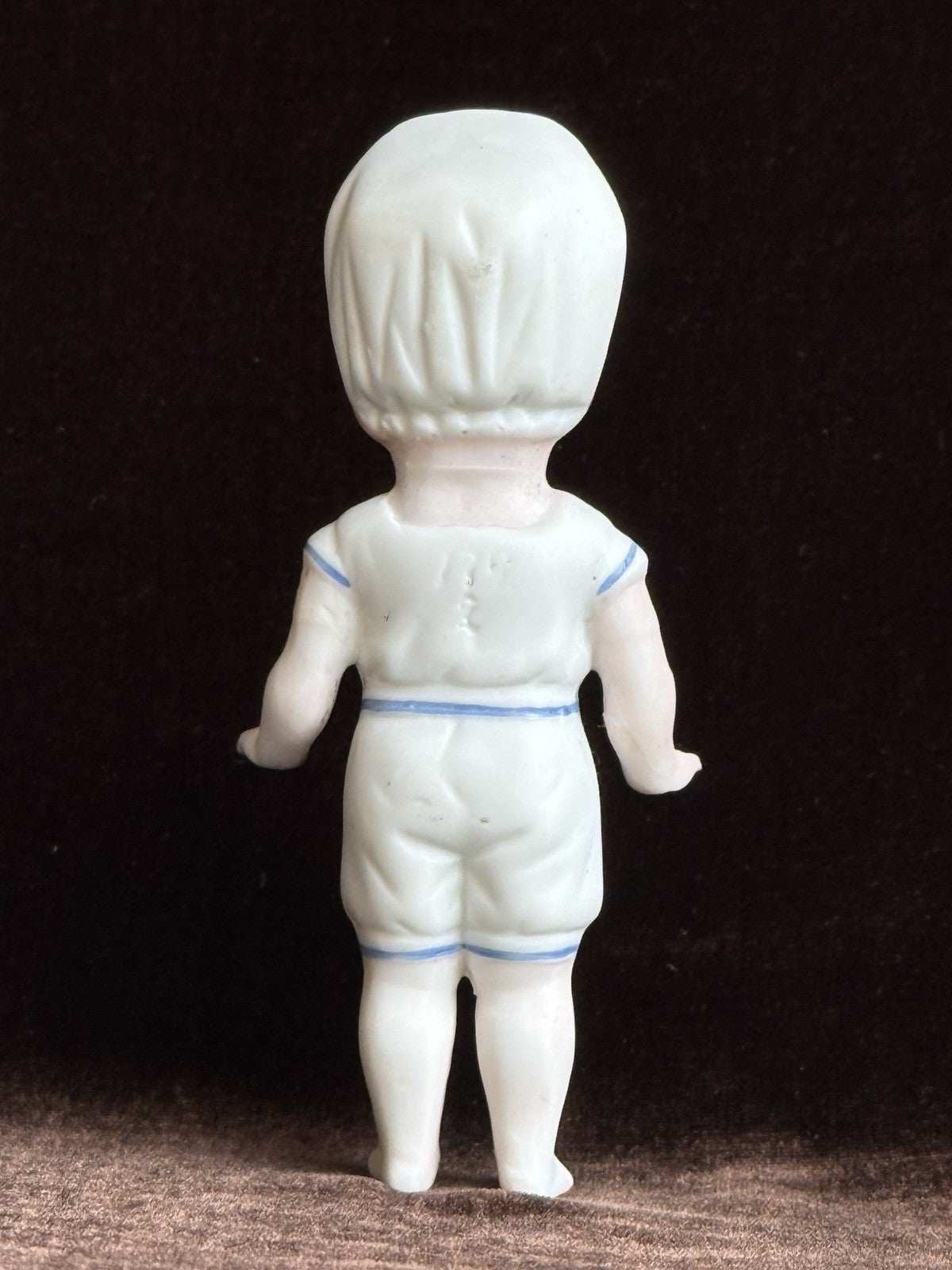 Antique German 4” Frozen Charlotte Bisque Doll With Molded Bonnet/Swim Suite