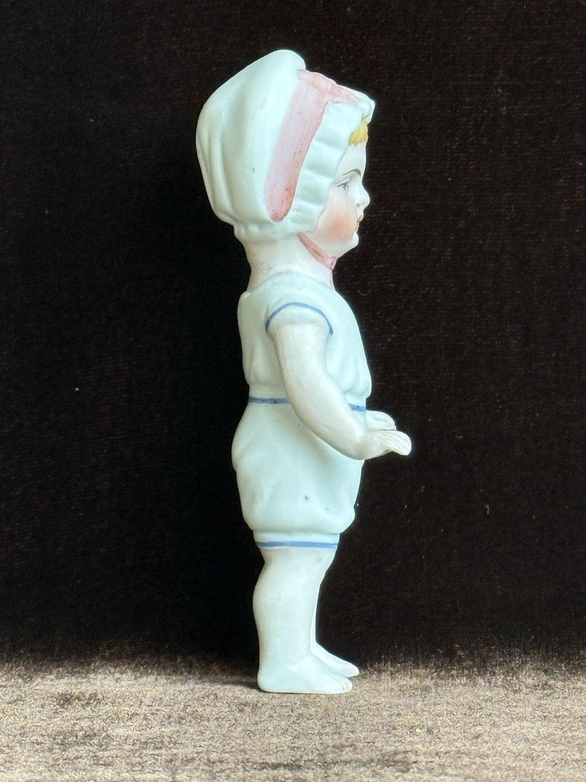 Antique German 4” Frozen Charlotte Bisque Doll With Molded Bonnet/Swim Suite