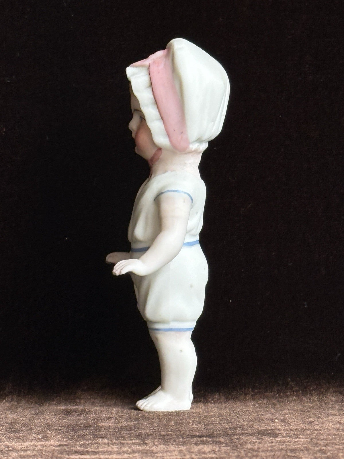 Antique German 4” Frozen Charlotte Bisque Doll With Molded Bonnet/Swim Suite